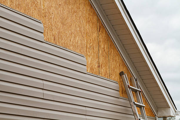 Professional Storm Damage Siding Repair technician working in Corry, PA